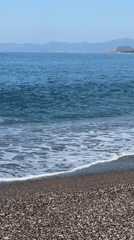 Tourist documents morning beach visit in Fethiye, Turkey