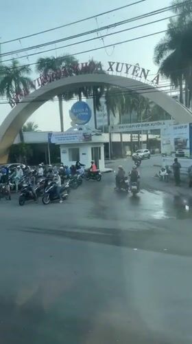 Evening street activity documented near Ho Chi Minh City hospital