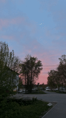 Mother documents evening stroll with toddler in Russian suburb