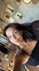 Woman takes selfie at restaurant in Sukawati, Indonesia
