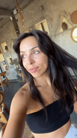 Woman takes selfie at restaurant in Sukawati, Indonesia
