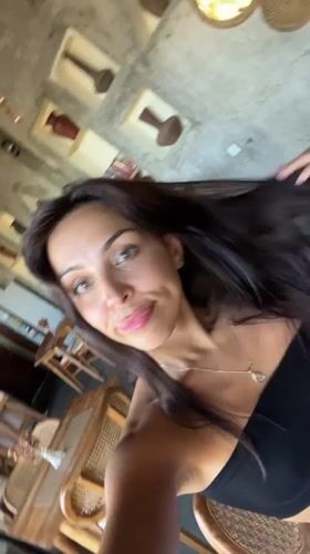 Woman takes selfie at restaurant in Sukawati, Indonesia