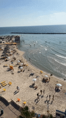 Summer afternoon captured at busy Netanya beach, Israel