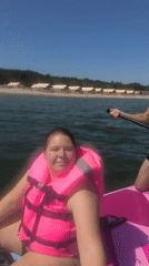 Paddleboarding off a calm Baltic beach in Yantarny