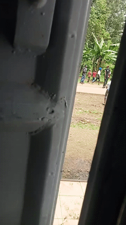Group walks along road in casual clothing Tuesday morning