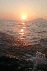 Fishing boat at sunset off the coast of Pesisir, Indonesia