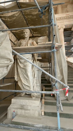 Roman statue restoration documented in ornate Brussels building