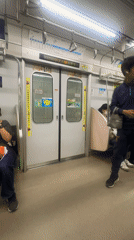 Passenger exits Japanese train with Yachiyo backpack at station