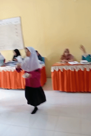 Students perform synchronized dance routines in Keudekrueng, Indonesia