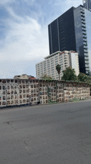 Paneled barricade with postings observed on Mexico City street