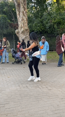 Woman dances to drumbeat in Buenos Aires street performance