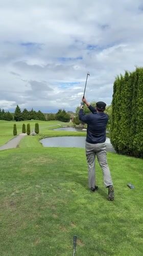 Evening golf session captured at Richmond course with scenic features