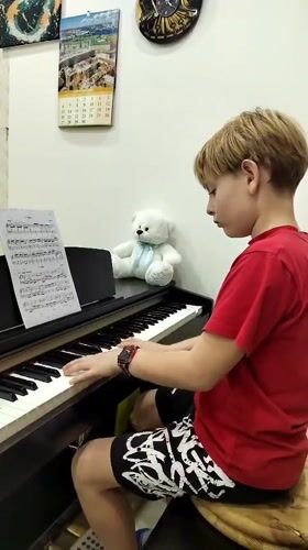 Young boy plays digital piano in Podgorica