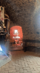 Tourist documents medieval artifacts during Saint Miklós Castle visit