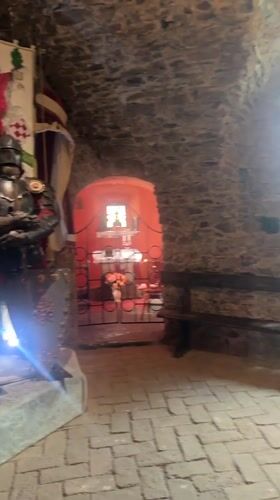 Tourist documents medieval artifacts during Saint Miklós Castle visit