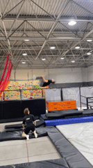 Young man practices acrobatics at Krasnoyarsk trampoline park
