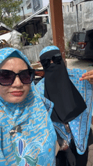 Two women take sunny day selfie in Lhokseumawe