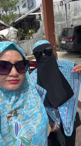 Two women take sunny day selfie in Lhokseumawe