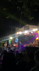 Live outdoor concert draws a crowd in Sidoarjo after dark