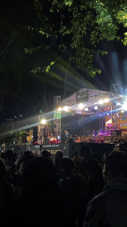 Live outdoor concert draws a crowd in Sidoarjo after dark