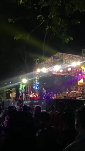 Live outdoor concert draws a crowd in Sidoarjo after dark