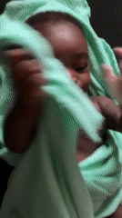 Infant wrapped in green towel observed in Nigeria