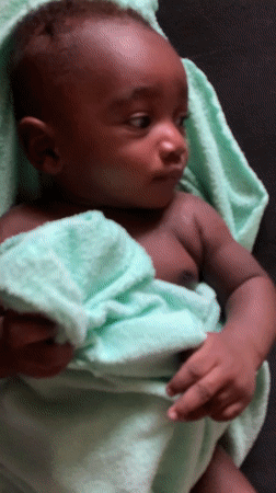 Infant wrapped in green towel observed in Nigeria
