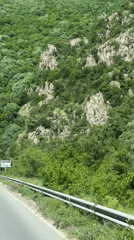 Car travels mountain road near Varvara, Bulgaria