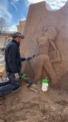 Sand sculpture exhibition draws crowds as helicopter patrols Petersburg waterfront
