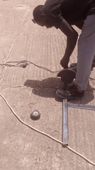 Metal cutting and outdoor labor on a busy urban work site