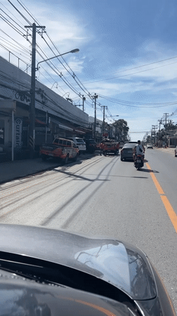 Morning street activity captured in Ko Samui, Thailand