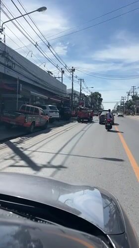 Morning street activity captured in Ko Samui, Thailand