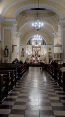 Late-night religious devotion documented at Catholic church in Tacna