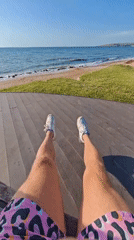 Beach relaxation captured on wooden deck in Shcholkino