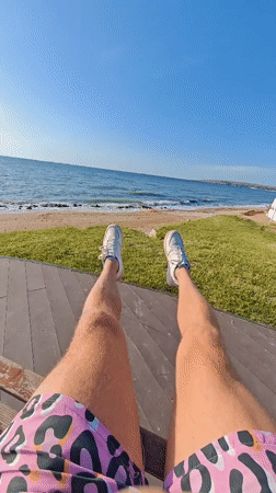 Beach relaxation captured on wooden deck in Shcholkino