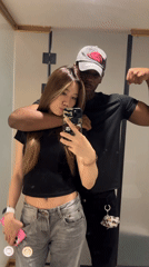Couple Takes Mirror Selfies in Yuzhong District Indoor Location