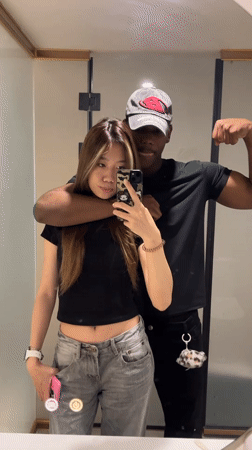 Couple Takes Mirror Selfies in Yuzhong District Indoor Location