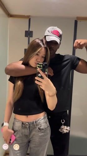 Couple Takes Mirror Selfies in Yuzhong District Indoor Location