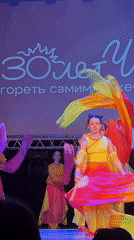 Youth performances with orange costumes documented in Chaikovsky theater