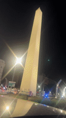 Night drive captures Buenos Aires landmarks in pink illumination