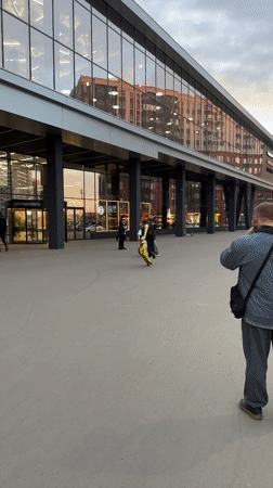 Woman shops and poses for photos in Murino, Russia