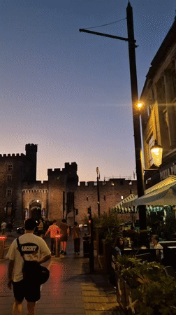 Cardiff Castle draws evening crowds during twilight hours