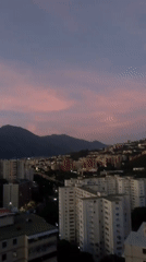 Witness documents twilight over Caracas hillside neighborhoods