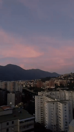 Witness documents twilight over Caracas hillside neighborhoods