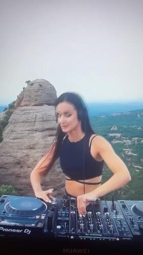 Woman DJs outdoor set in Novokuybyshevsk with Pioneer equipment