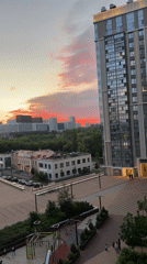 Urban sunset with apartment building and golden light