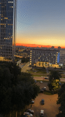 City skyline at sunset, aerial and balcony perspectives