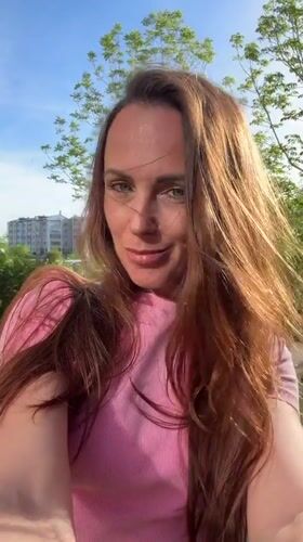 Woman takes selfies around Birobidzhan during morning photo session
