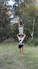 Couple performs shoulder balancing act in Argentine park