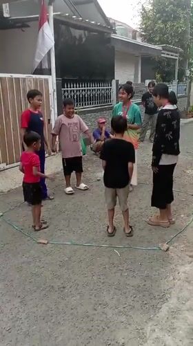 Neighborhood street games and festivities in a flag-lined alleyway